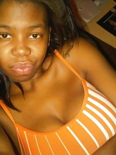 Naughty Black Bitch Posing Sleazy In See Through Underwear